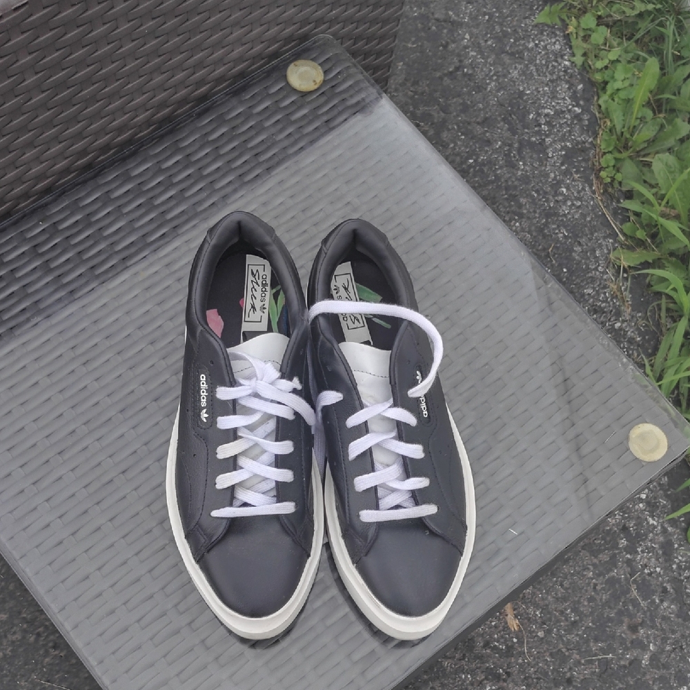 Classic Adidas sneakers in black with white details